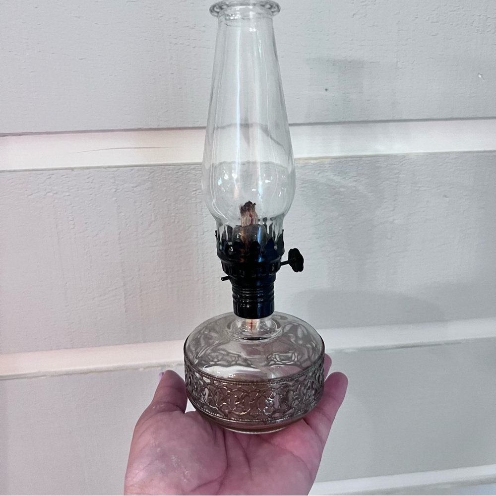 Vintage glass light globe with brass base.